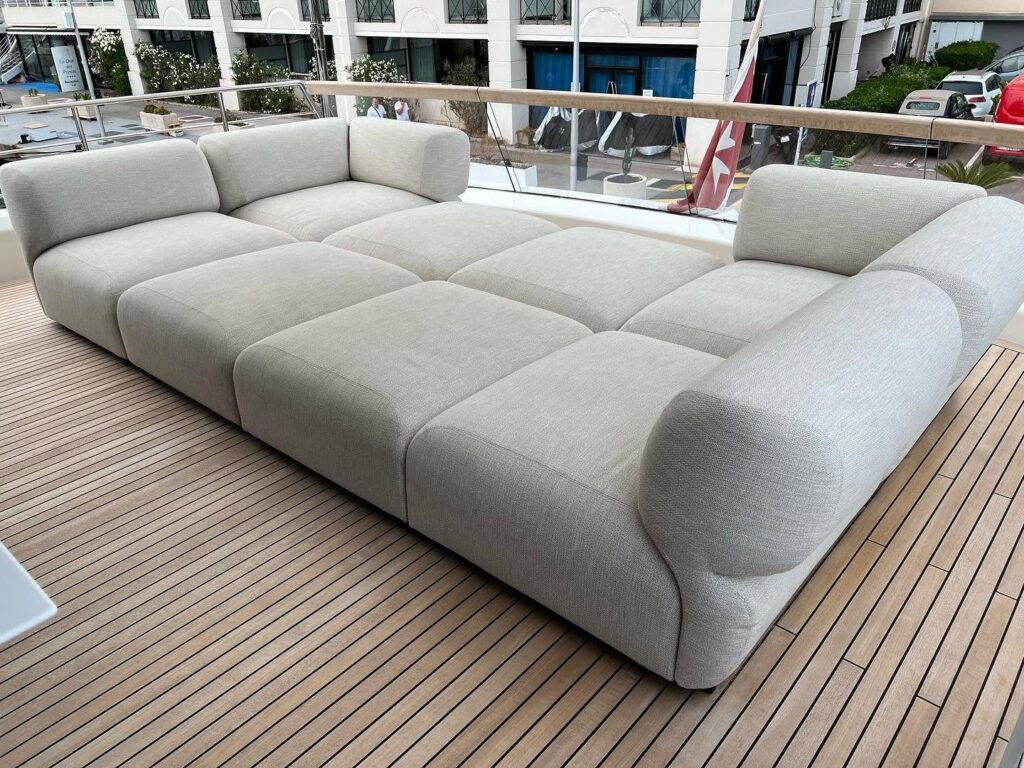 Deck sofa cleaned on board a yacht in Cap-d'Ail harbour